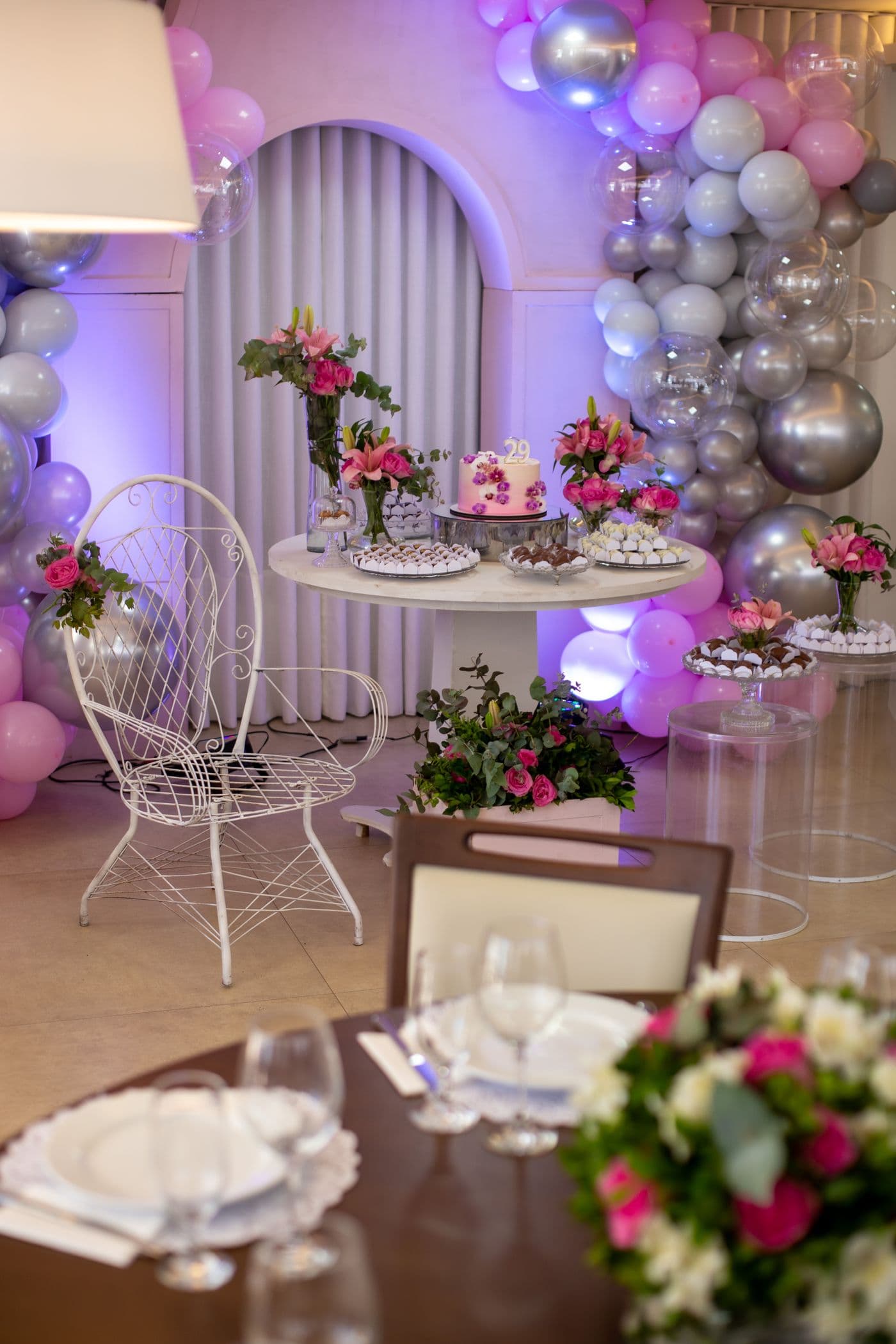 Balloon arch over a dressed party table